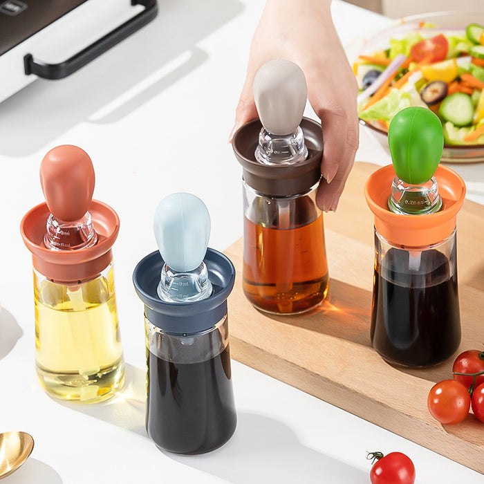 Olive oil spray bottle for cooking, grilling, and baking Glass kitchen olive oil bottle, Vinegar BBQ Grill Frying Baking Silicone Soft Brush, and 2 in 1 silicone cooking equipment are also included. Bottle for dispensing oil with a silicone brush.